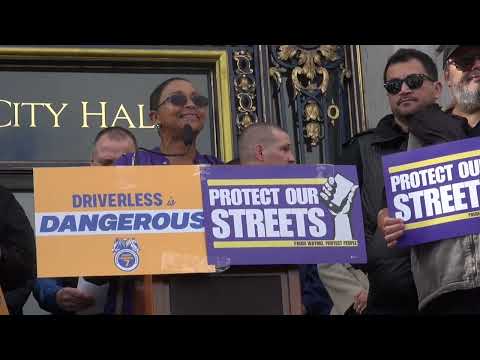 Drivers and unions rally against robotaxis at City Hall