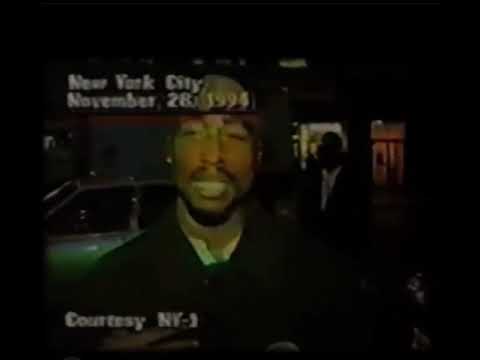 Tupac speaks to reporters outside a New York courthouse