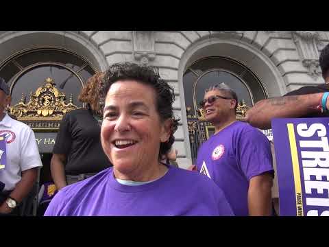 Drivers and Teamsters rally against robotaxis at City Hall
