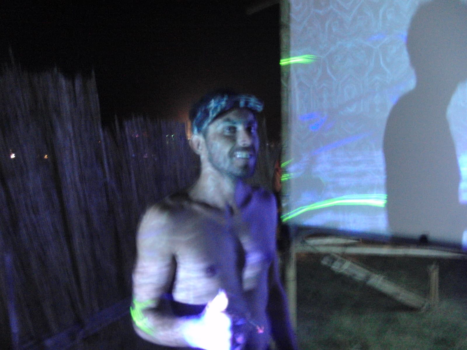 Body painted performer under ultraviolet light, Boom 2010