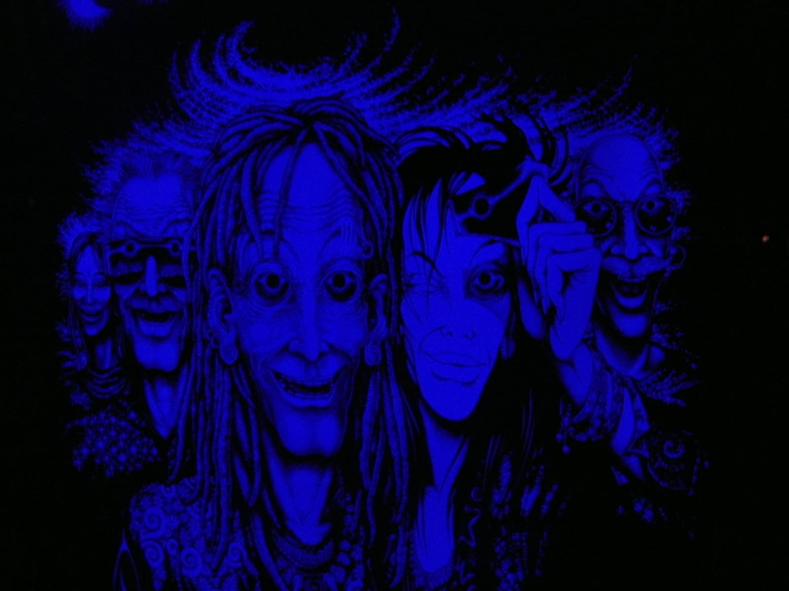 Ultraviolet painted faces on a backdrop, Boom 2010