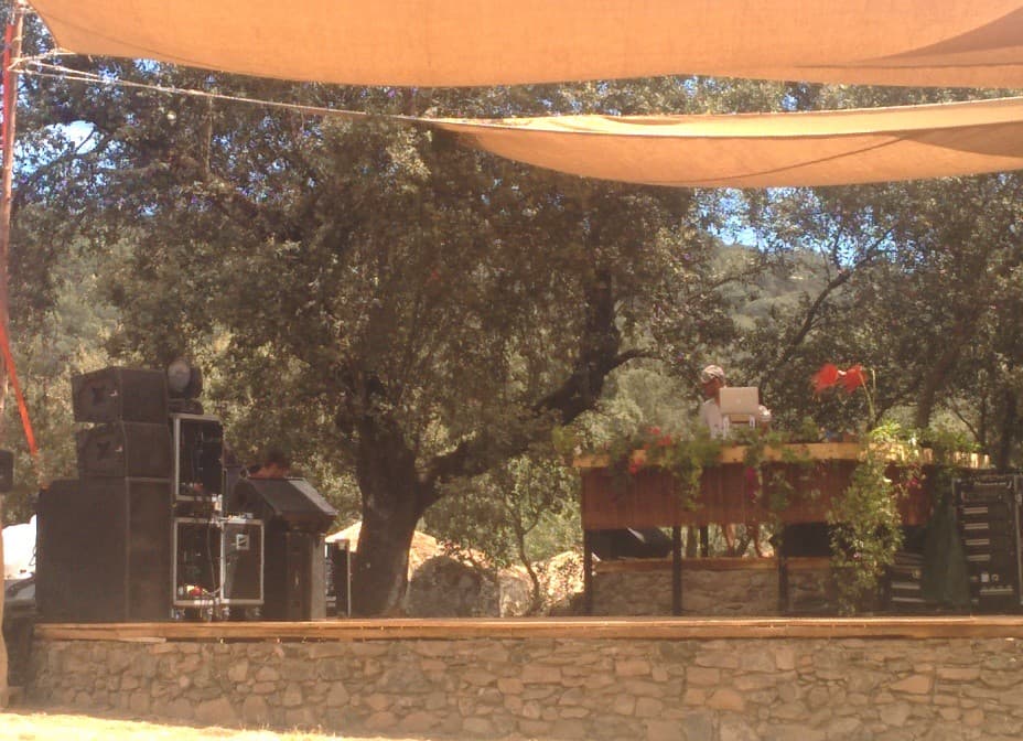 Speaker stacks beside a shaded platform, Boom 2014