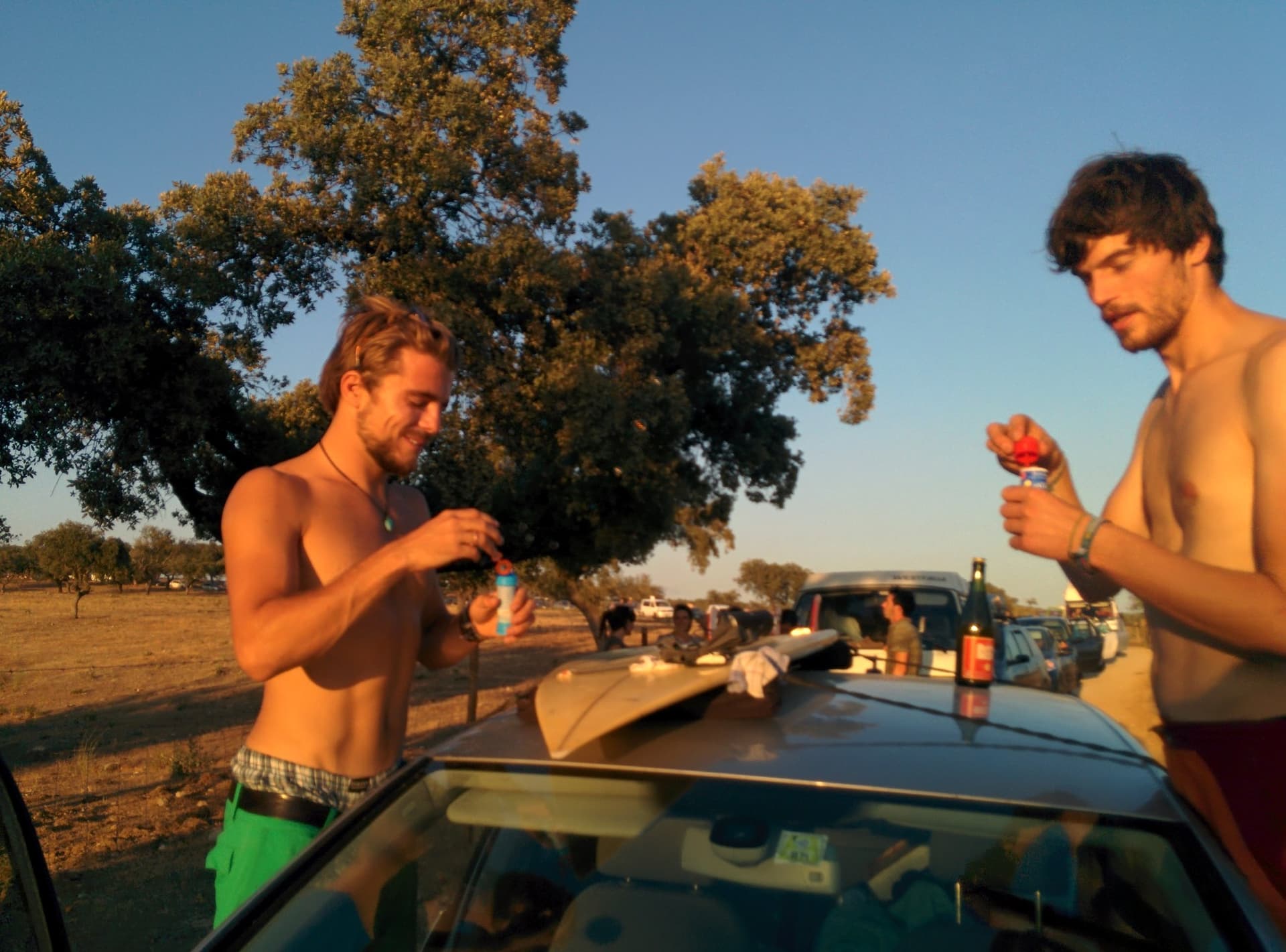 Packing up beside a car after the festival, Boom 2014