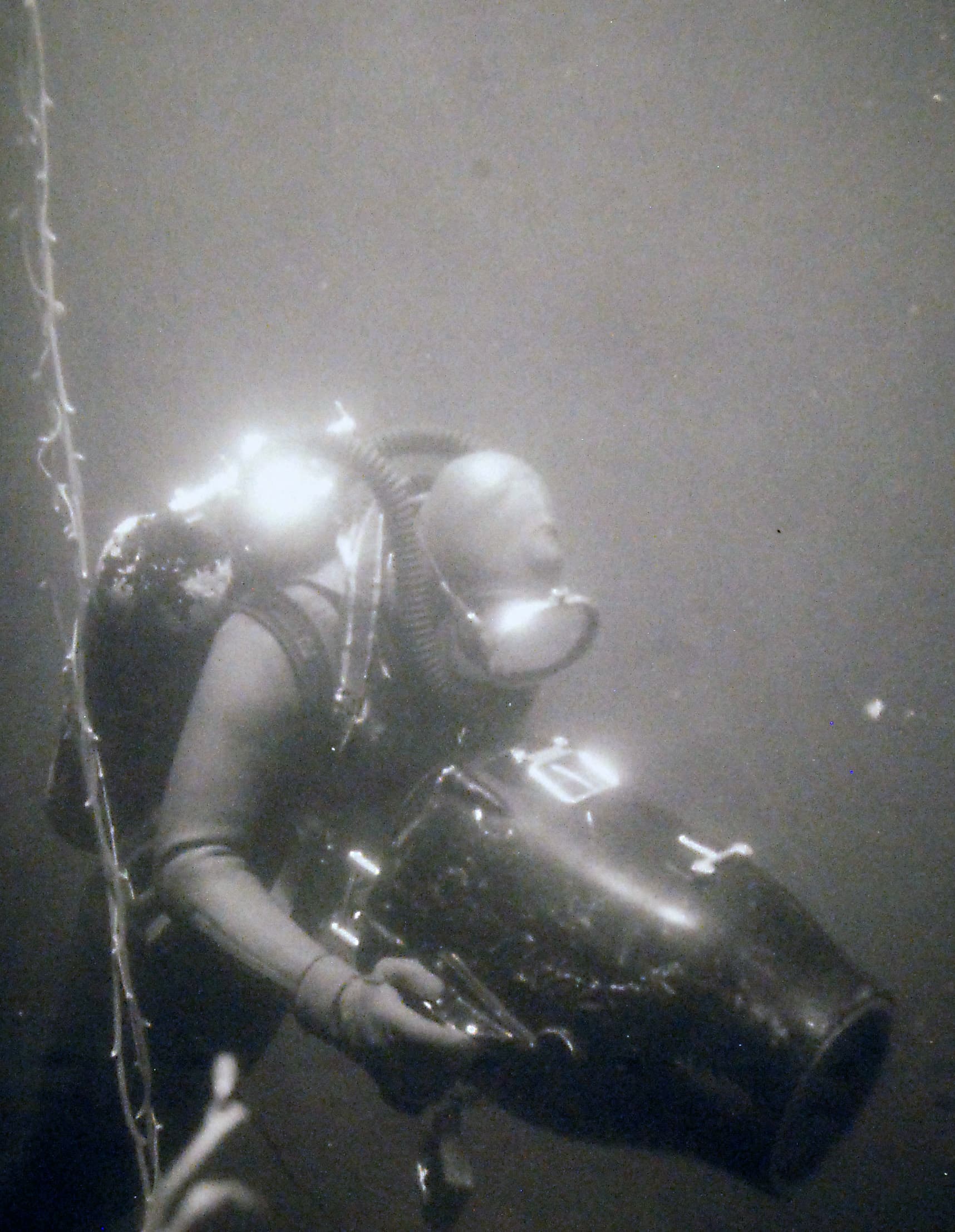 An underwater photographer with a Mitchell Monitor 16mm camera