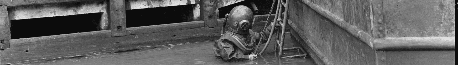 A helmet diver descending at Amsterdam, 1953