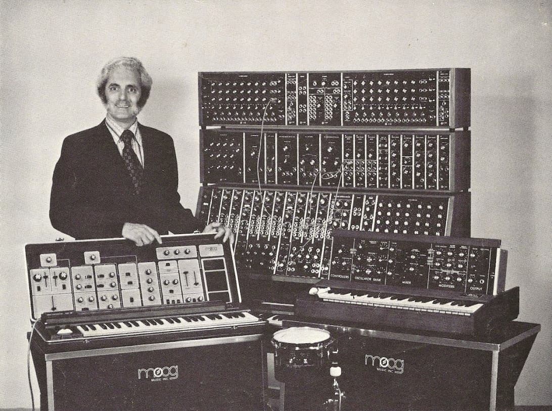 Robert Moog with his modular synthesizers around 1974