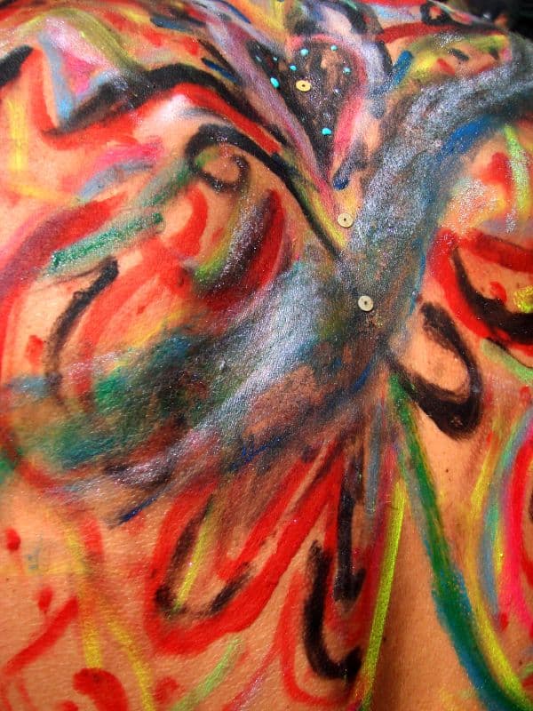 Body paint in red, black and green