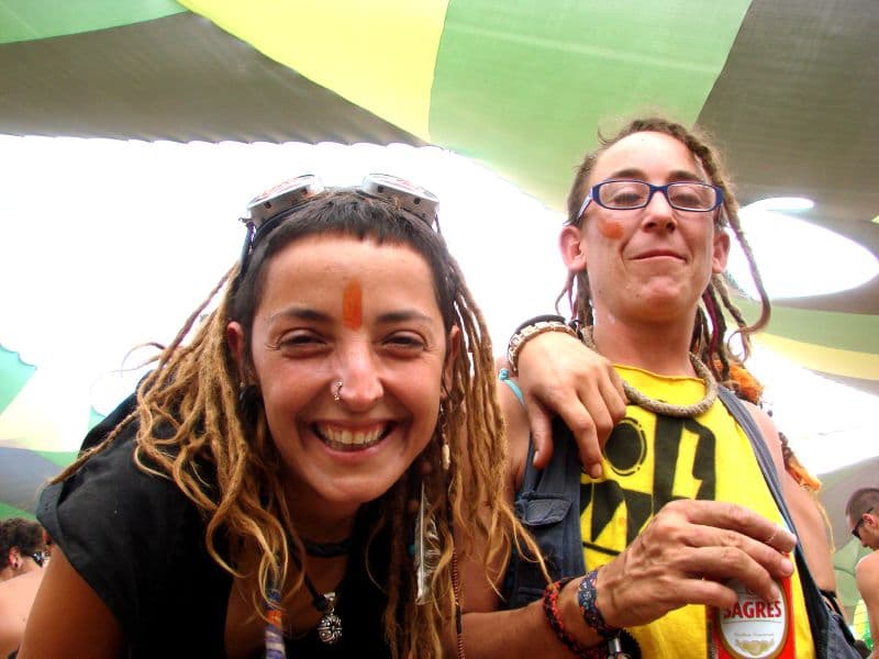 Two friends under the coloured canopies