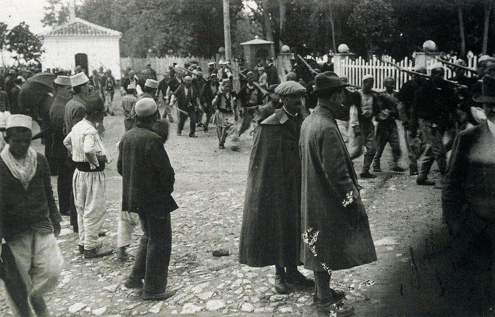 Northern Albanian troops march past the konak