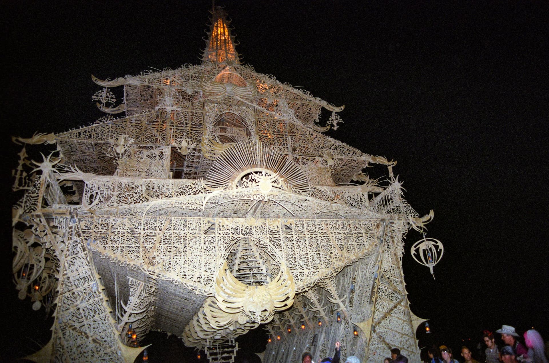 The Temple of Joy, lit at night · 4/7