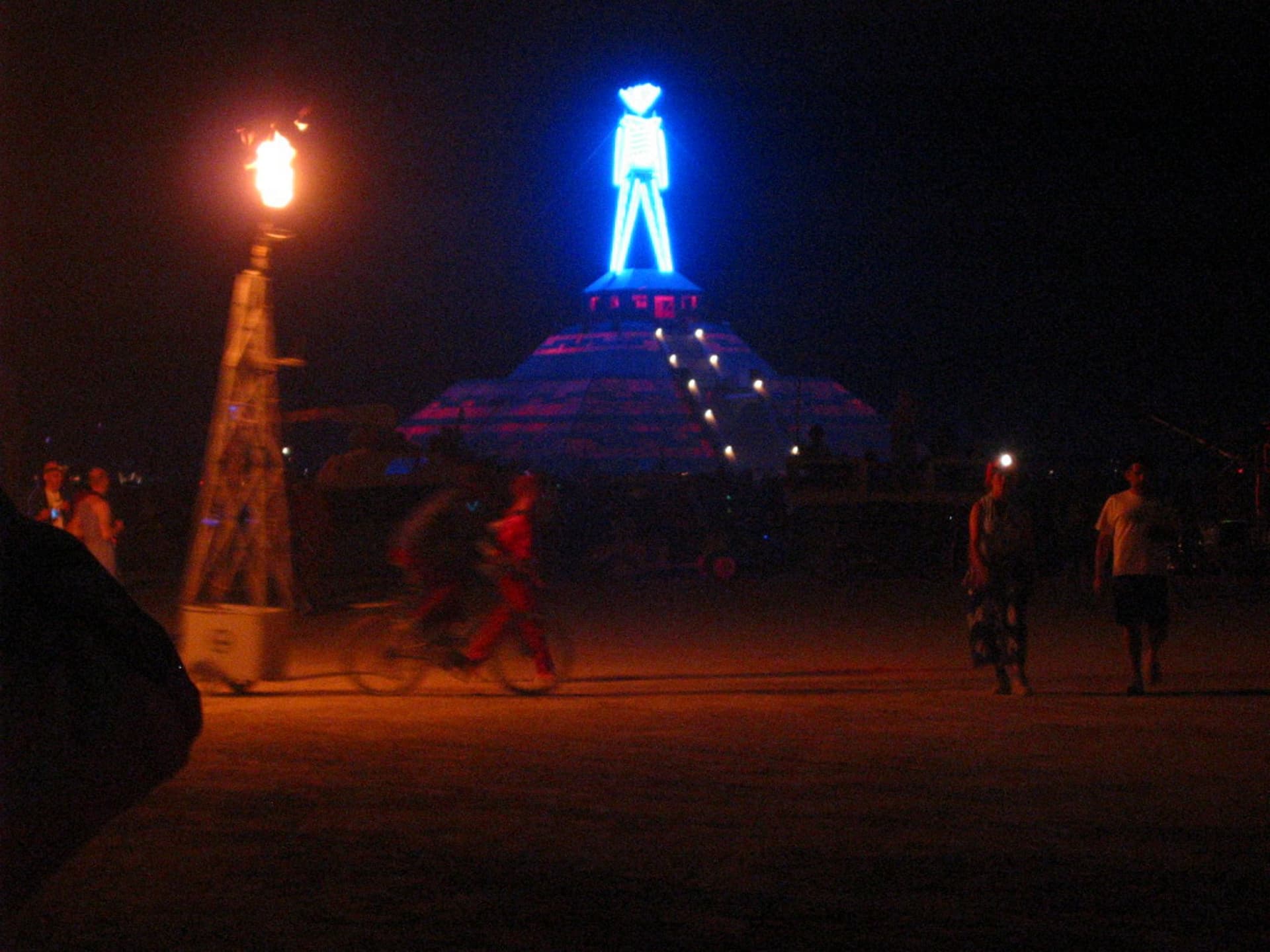 The Man over the burn-night crowd · 2/3