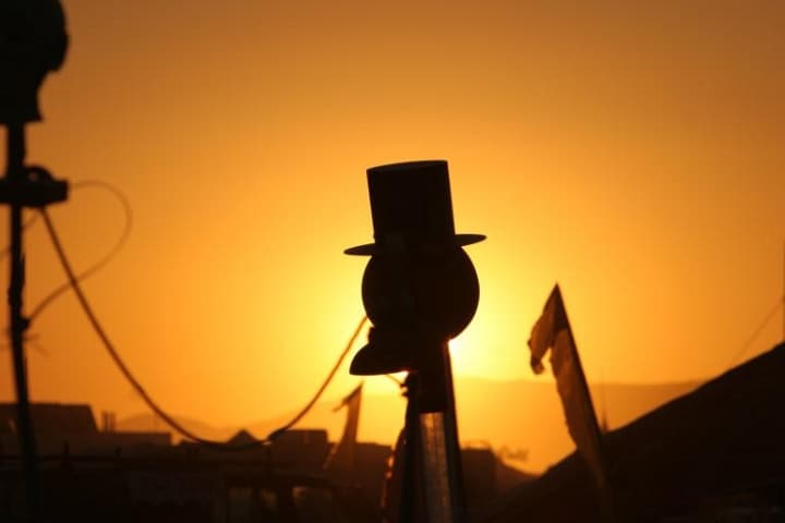 Sunset over the tent city · 8/9