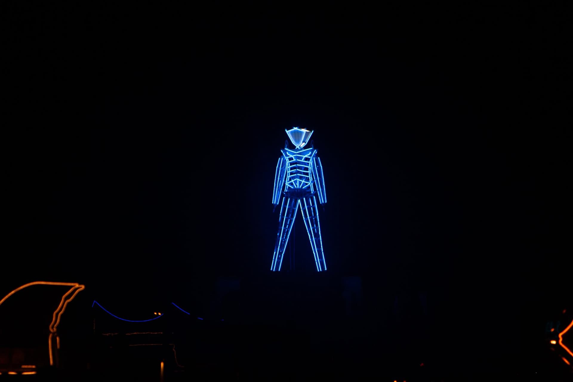 The blue-neon Man over the city · 5/5