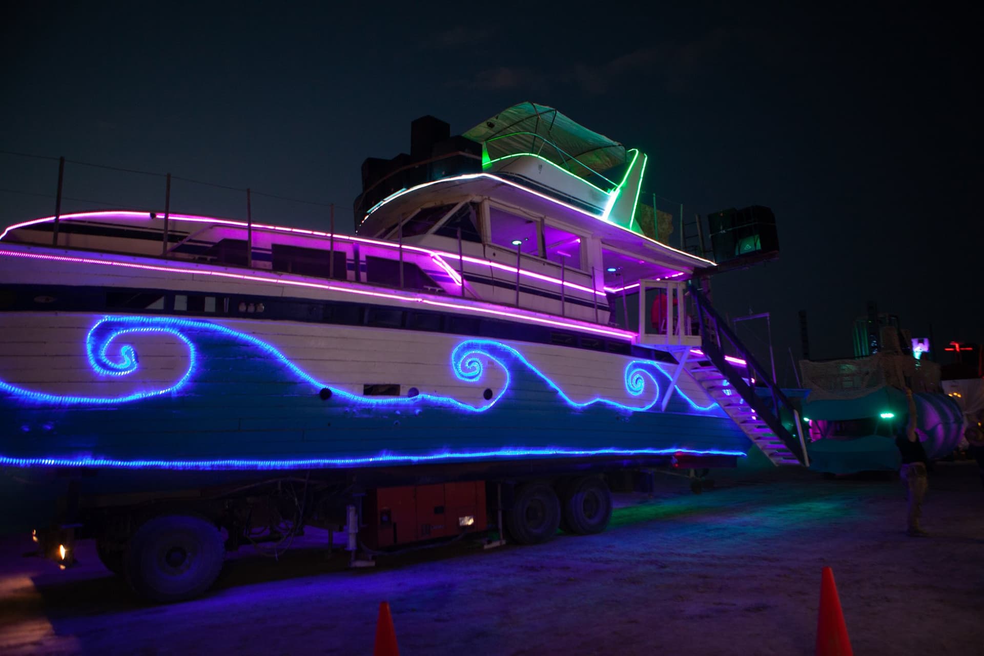 The neon art cars at night · 4/15