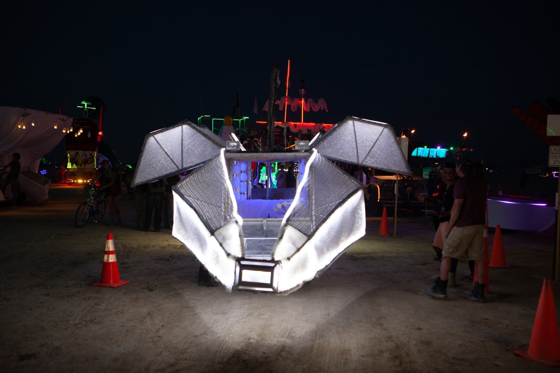 The neon art cars at night · 5/15