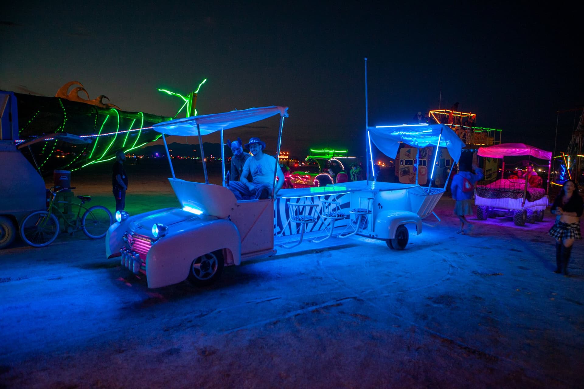The neon art cars at night · 10/15