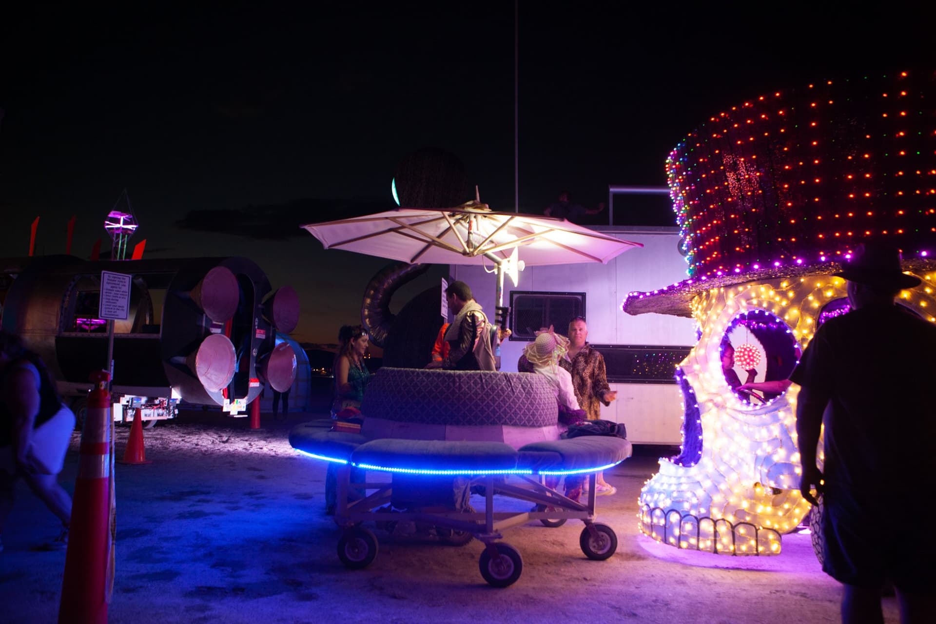 The neon art cars at night · 12/15