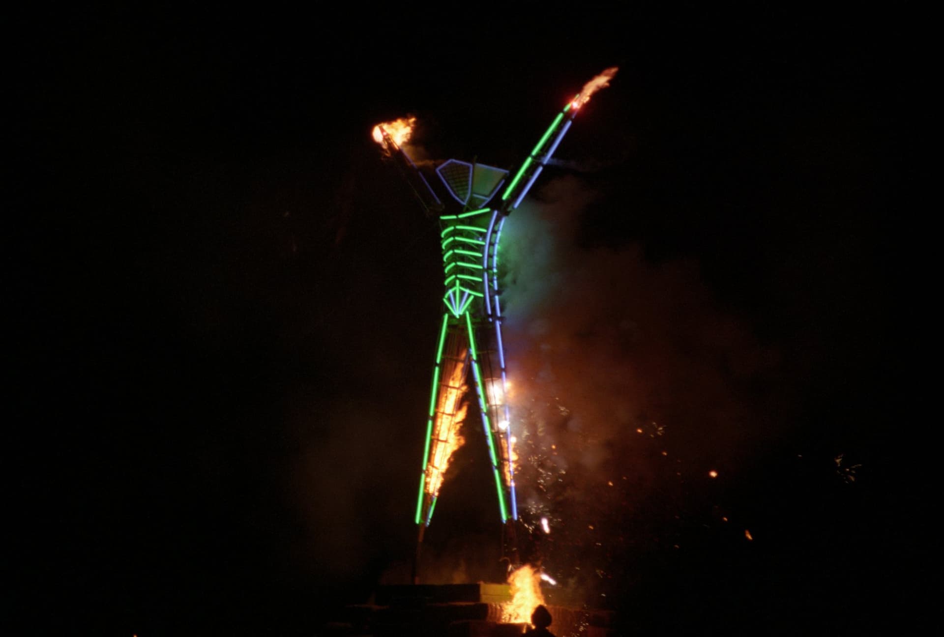 The Man, arms on fire · 14/16