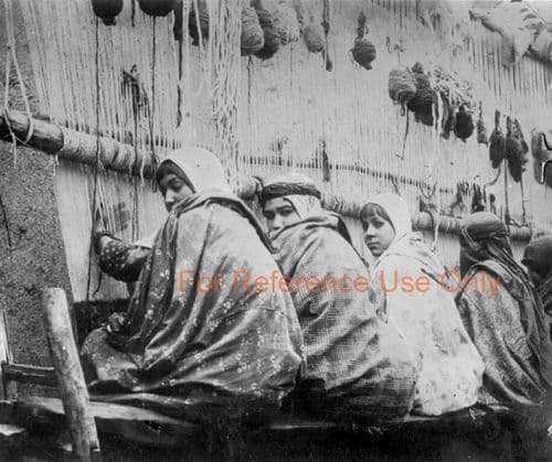Girls weaving a large carpet, Persia