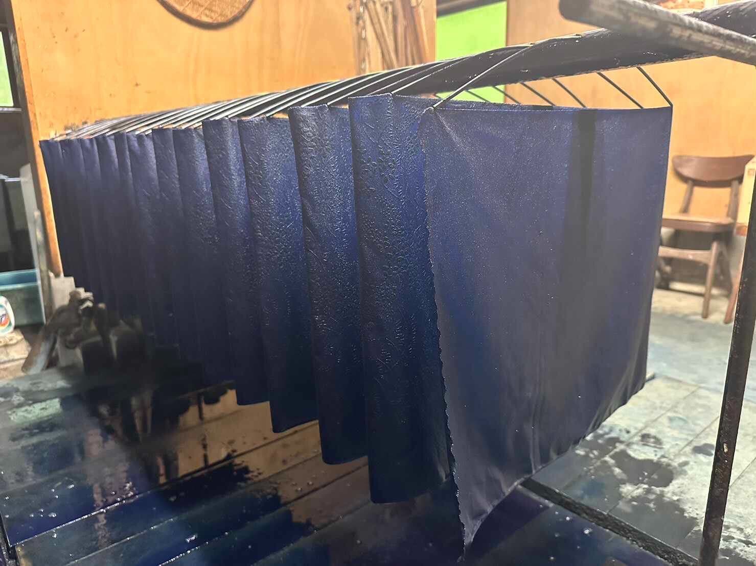 Indigo-dyed fabric raised from the dye vat