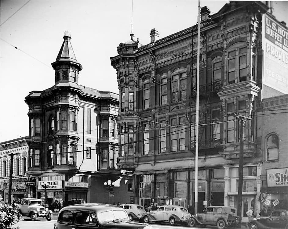 East side of Main at Requena, United States Hotel at right, 200–202 N. Main at left