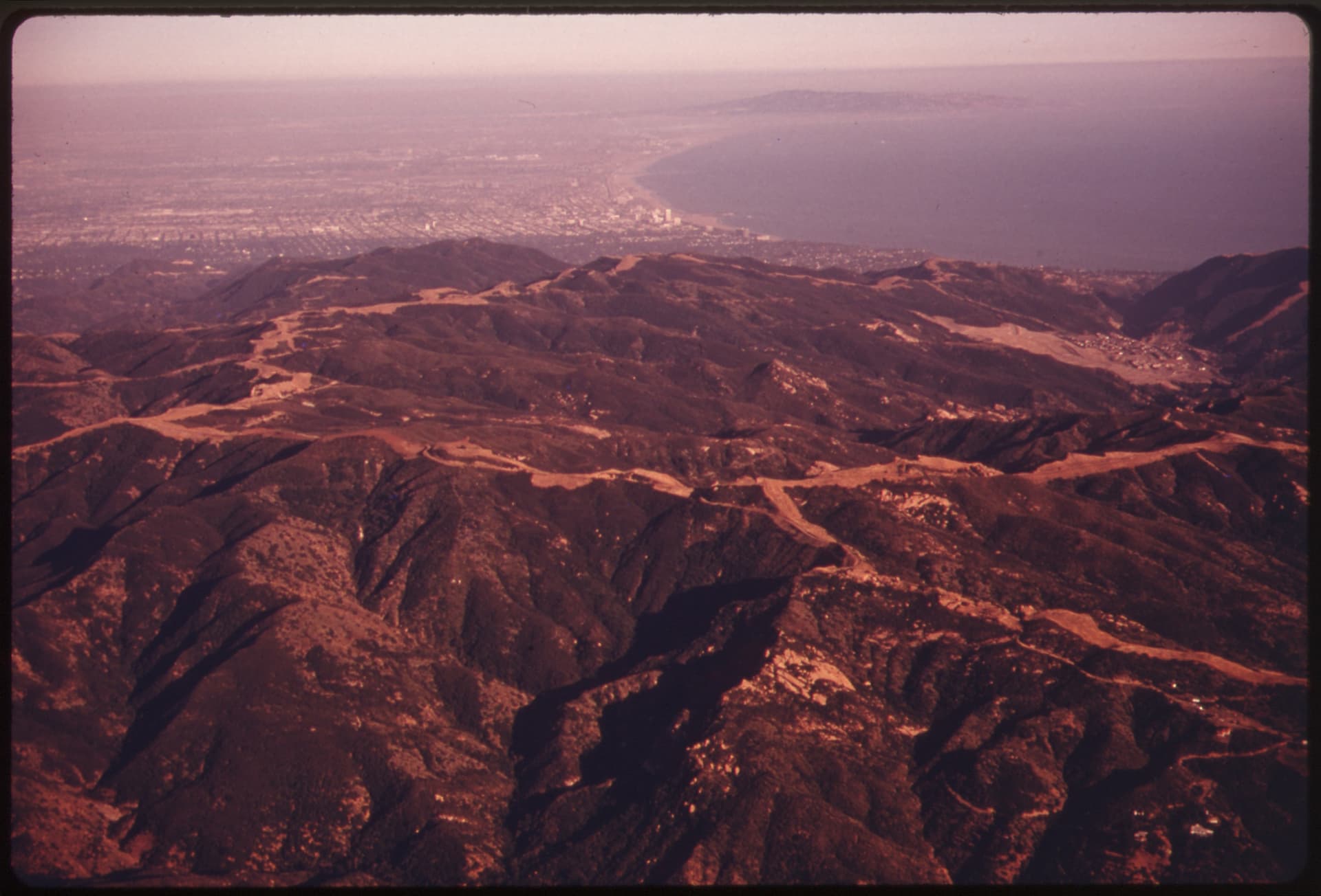 AERIAL OF THE SANTA MONICA MOUNTAINS LOOKING SOUTH, NEAR MALIBU, CALIFORNIA, WHICH IS LO…