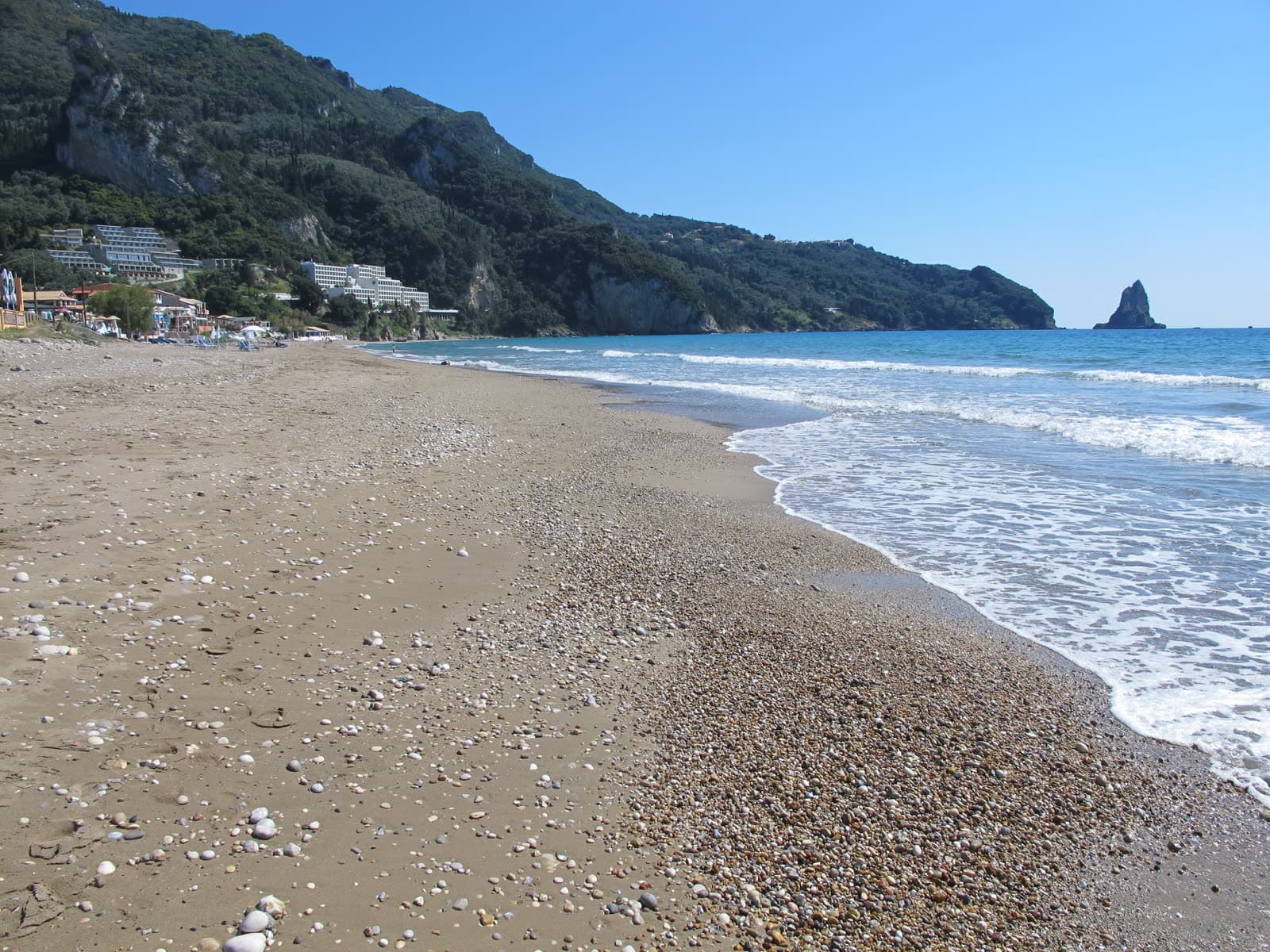 The sand and shallow water of Agios Gordios beach (5 of 6)