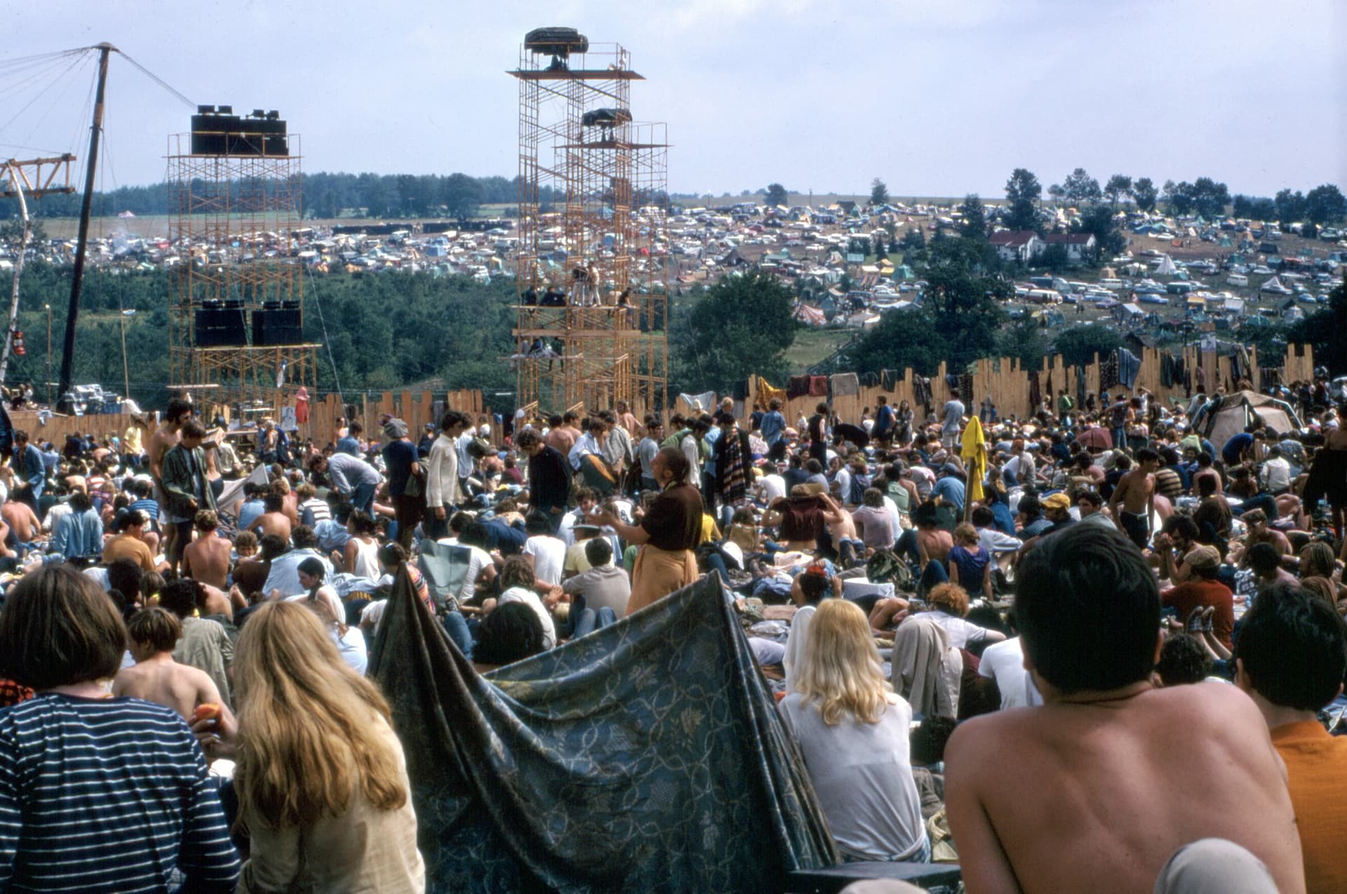 Blanket rigged as a tent while the crowd waits for Joe Cocker