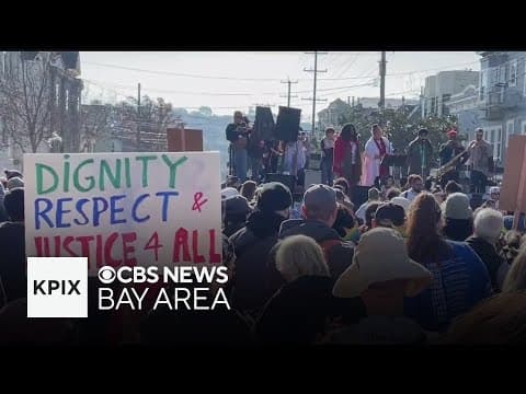 Activists march through the city before the inauguration