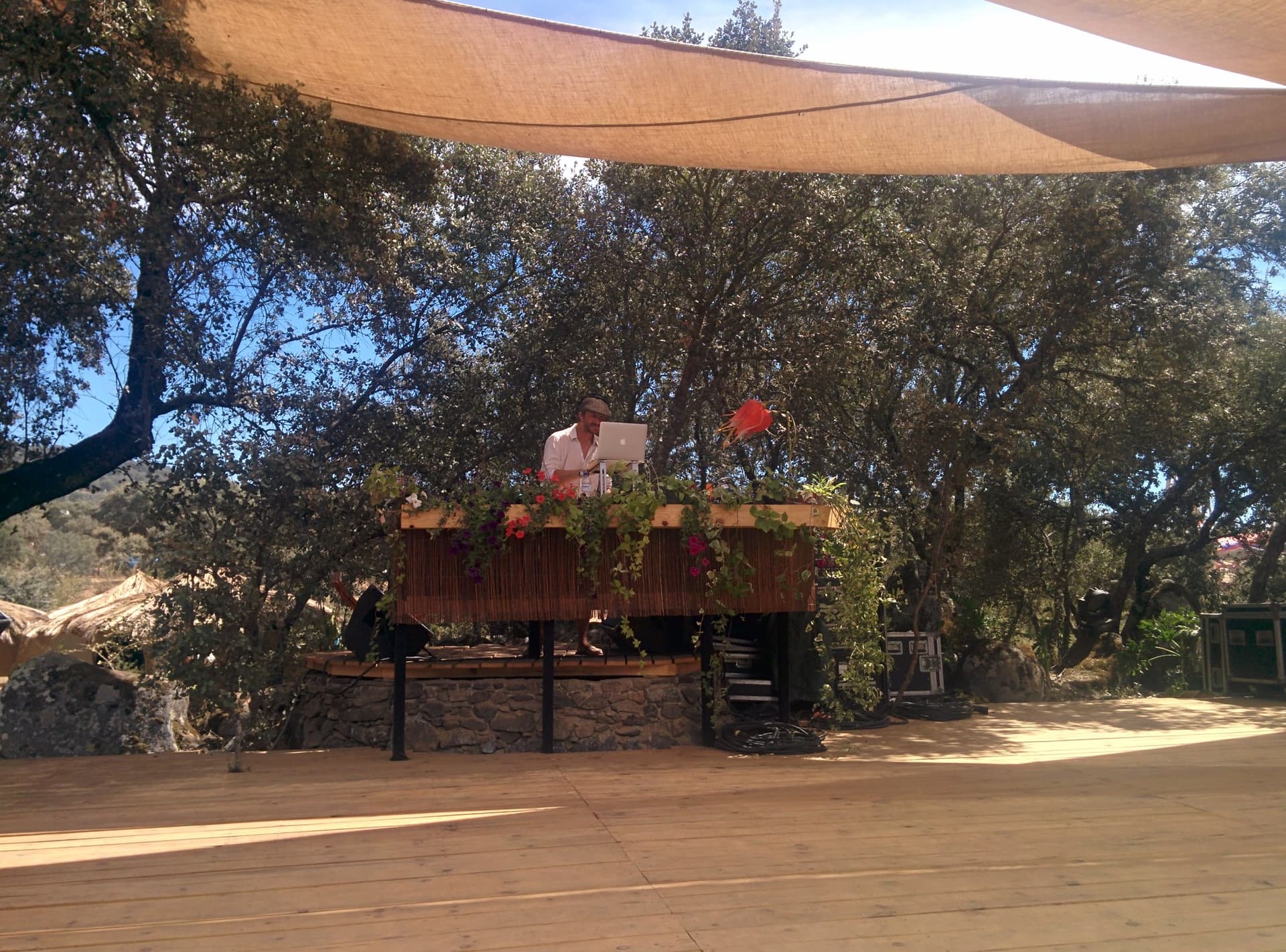 Small stage under a tan canopy, Boom 2014