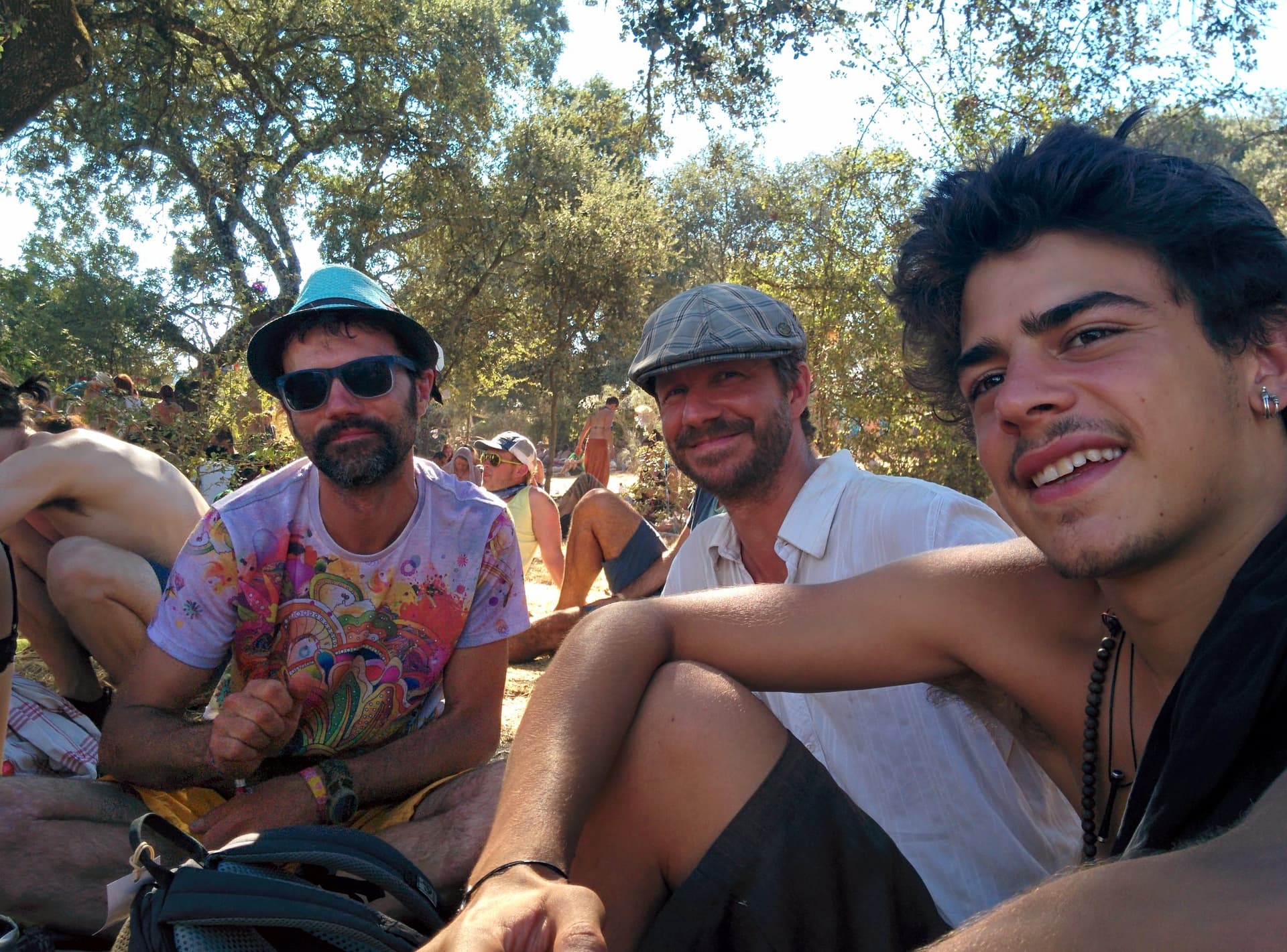 Friends sitting together on the ground, Boom 2014