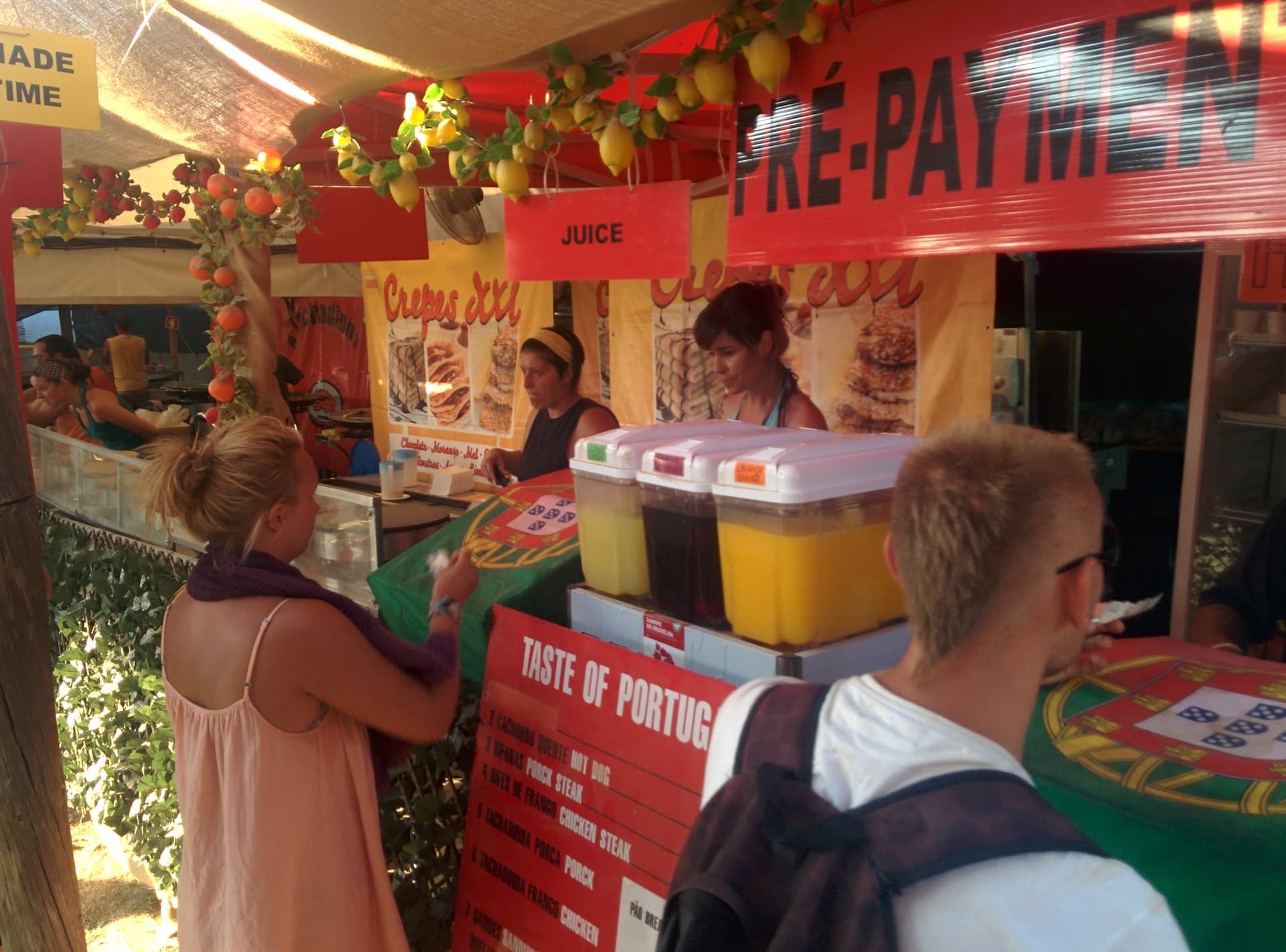 Ordering at a juice and food stall, Boom 2014