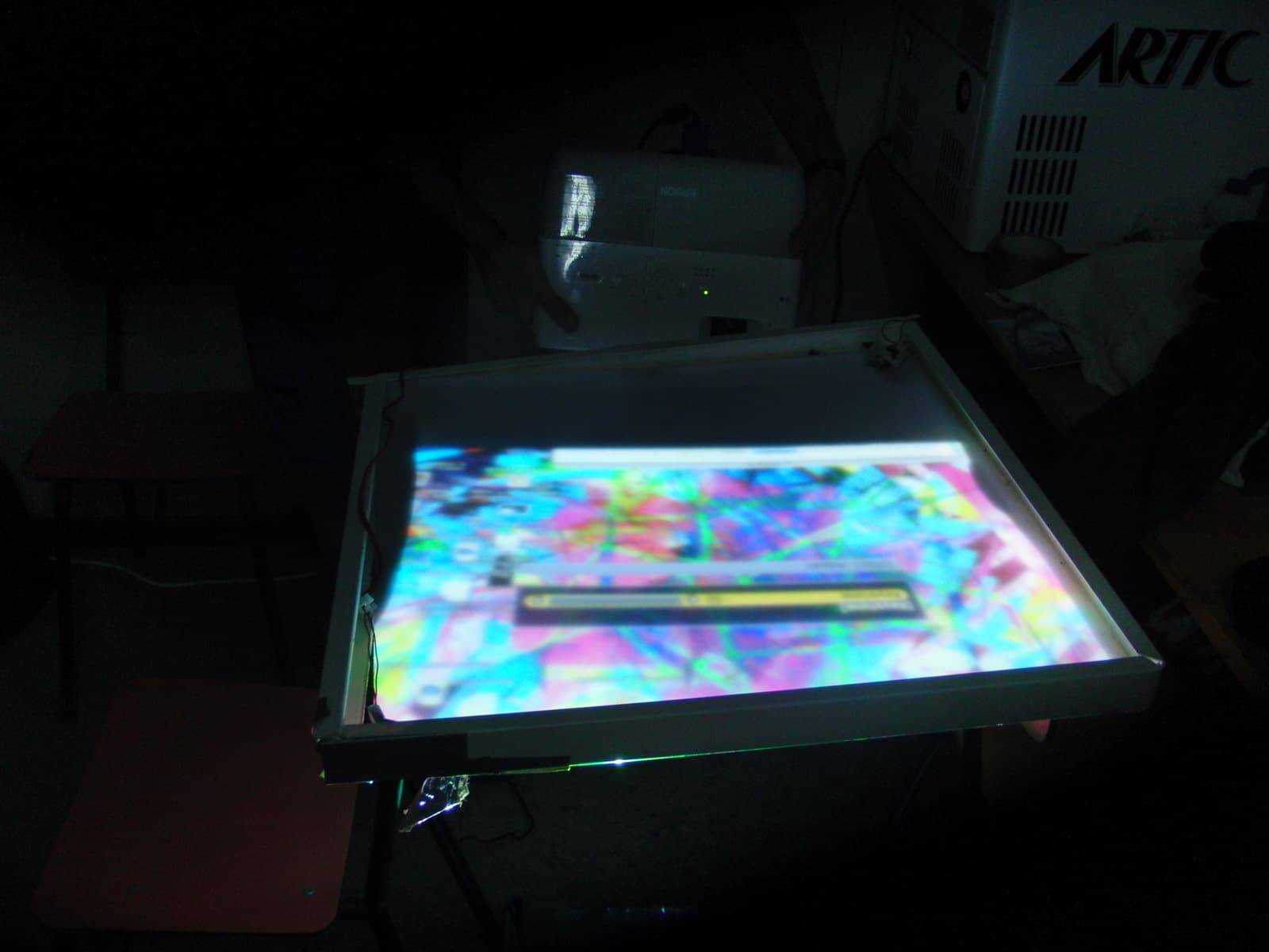 Backlit control table glowing with colour, Boom 2010