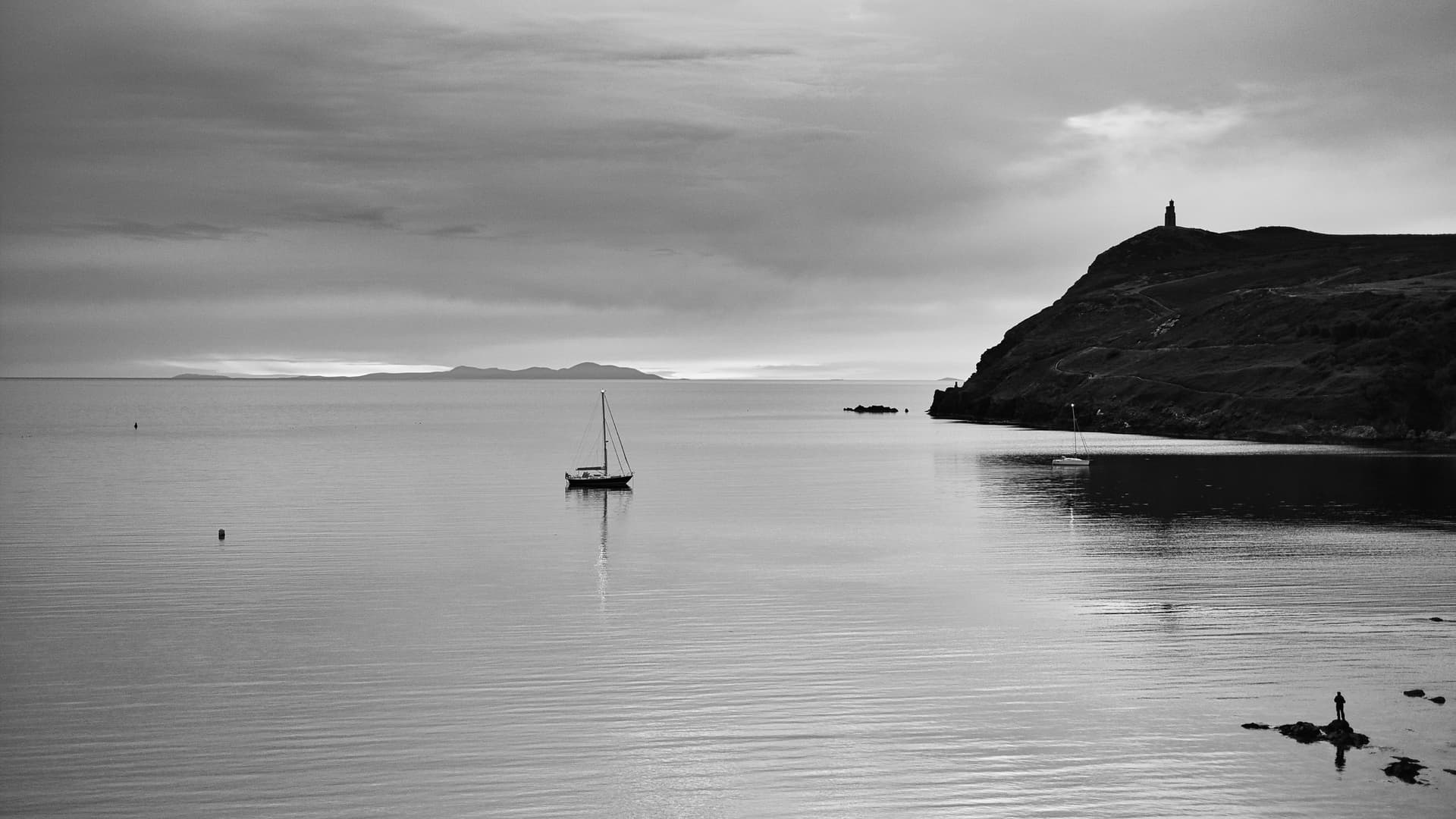 Yachts anchored off Port Erin Beach with the Mourne Mountains (Ireland) and Bradda Head in the background