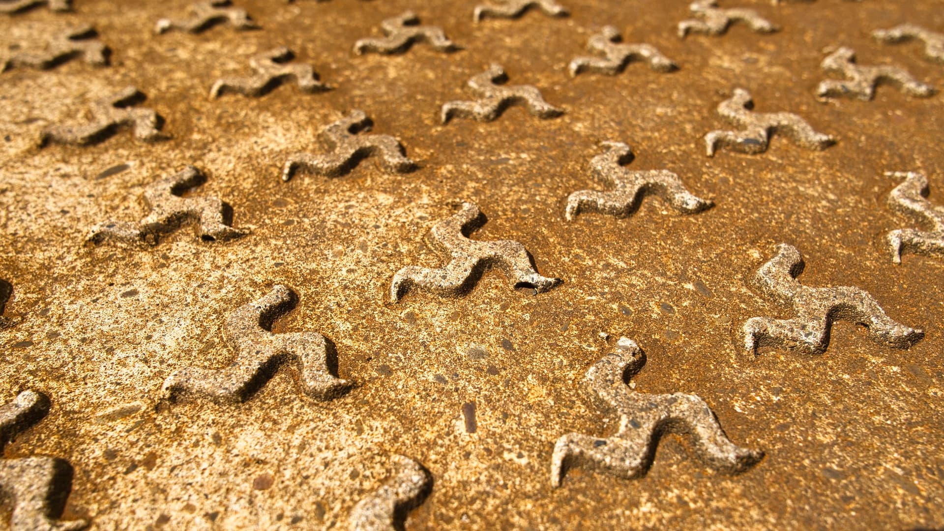 Triskelion design on metal plate
