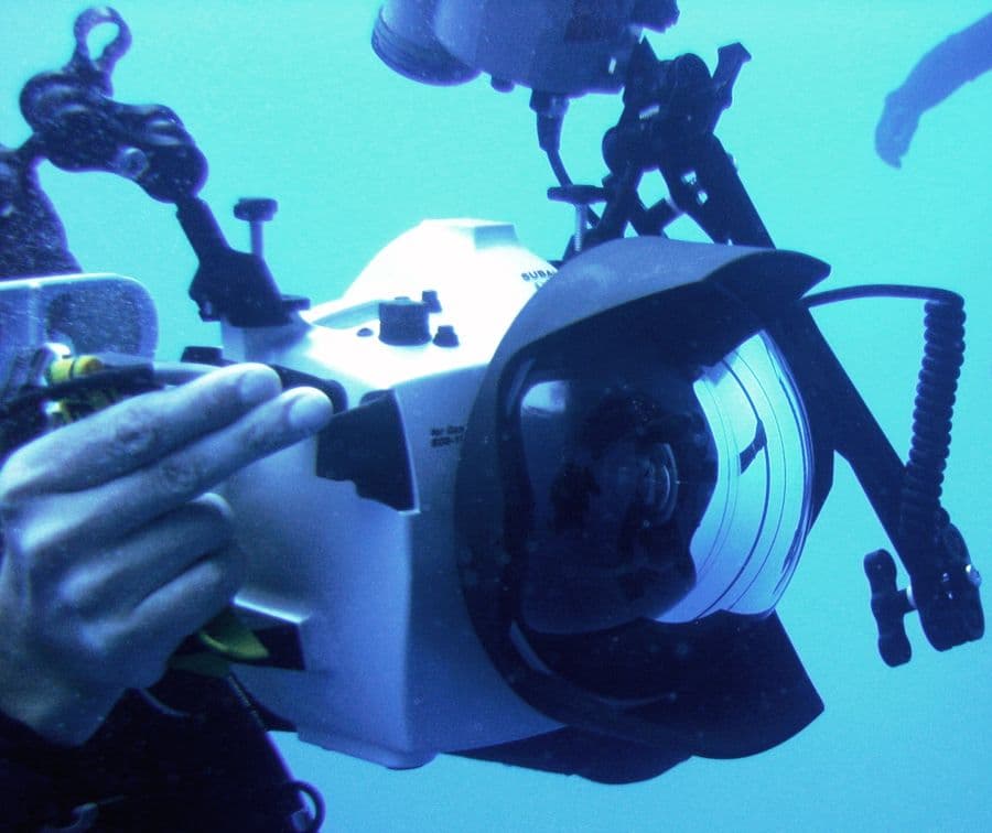 A diver with an underwater stills camera