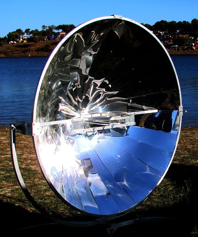Parabolic solar cooker beside the lake