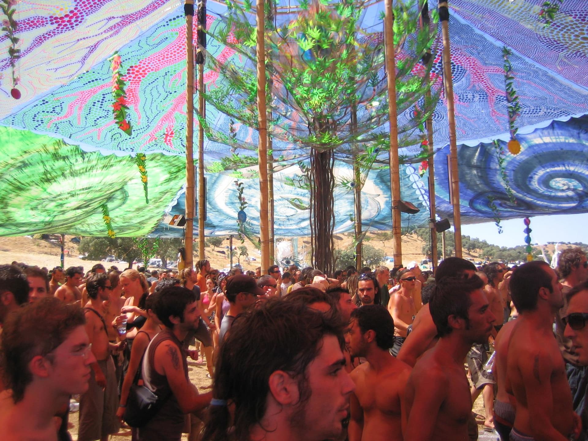 Painted poles and canopy over the crowd