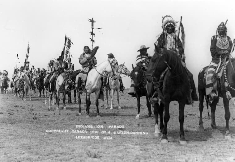 Procession of men of the Blackfoot Confederacy on horseback