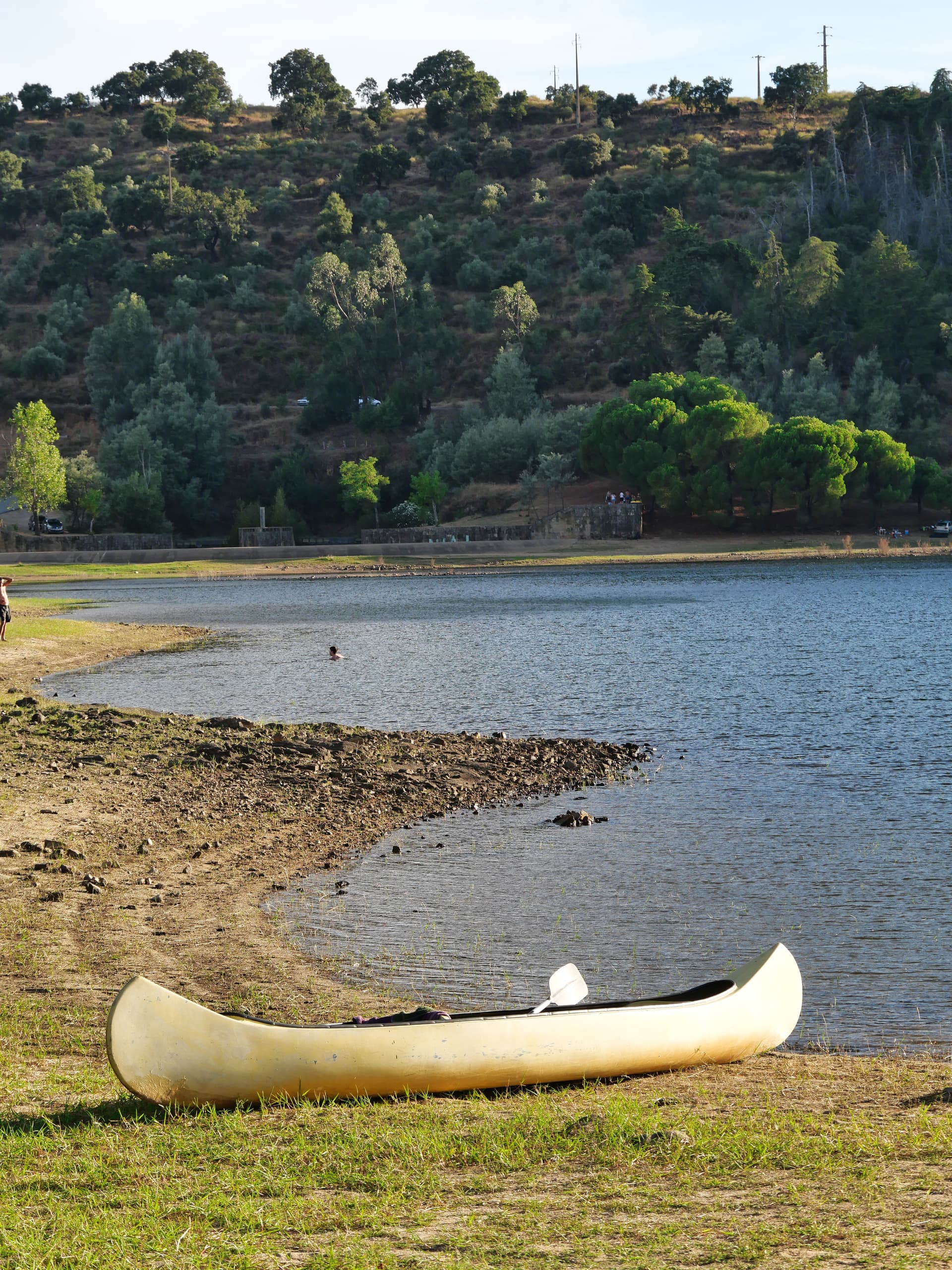 Canoe on the bank of the reservoir
