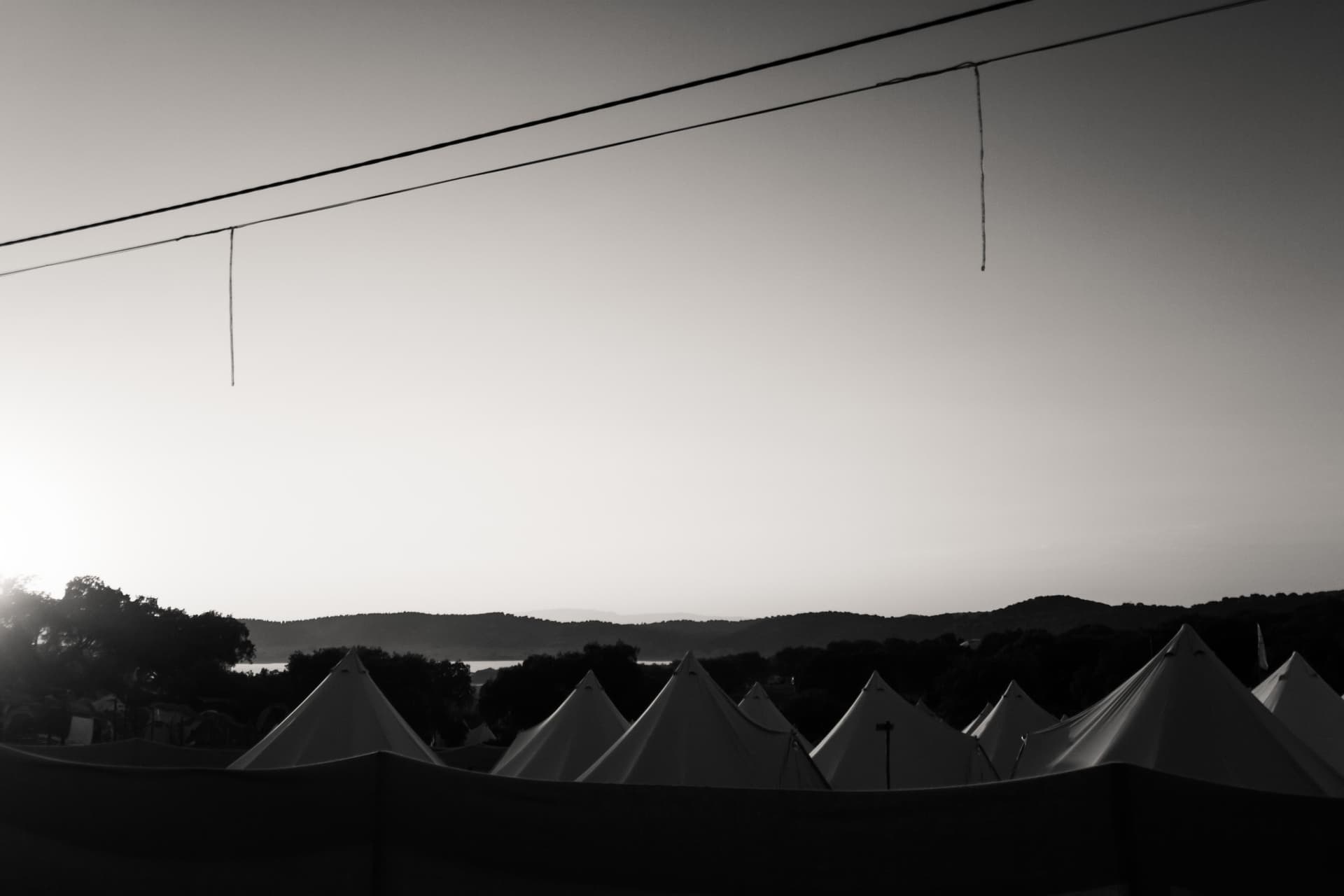 Tent roofs on the horizon at dawn