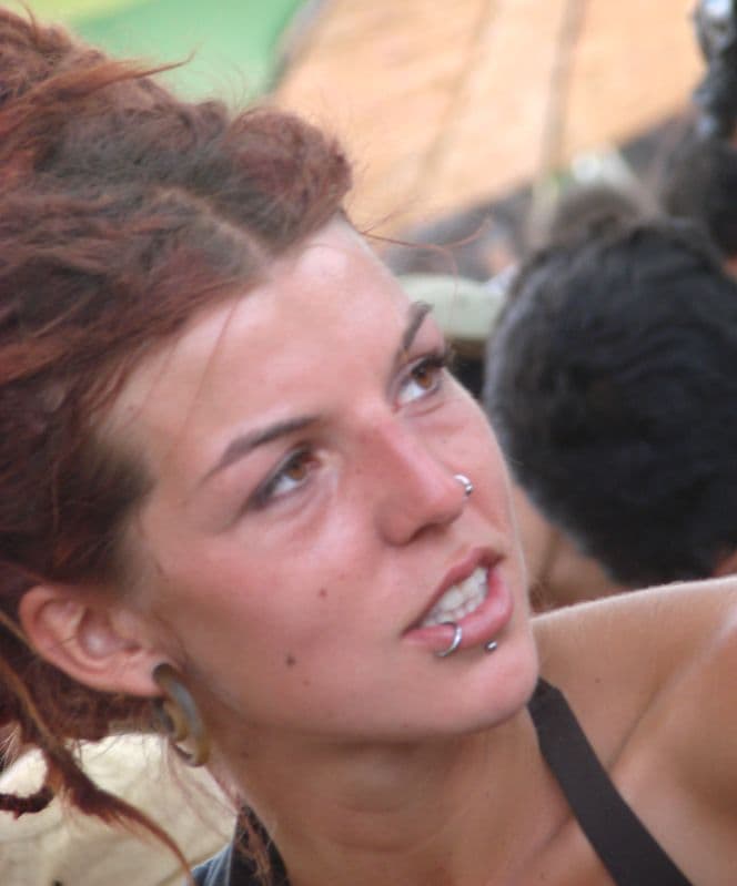 Visitor with a lip piercing in the crowd