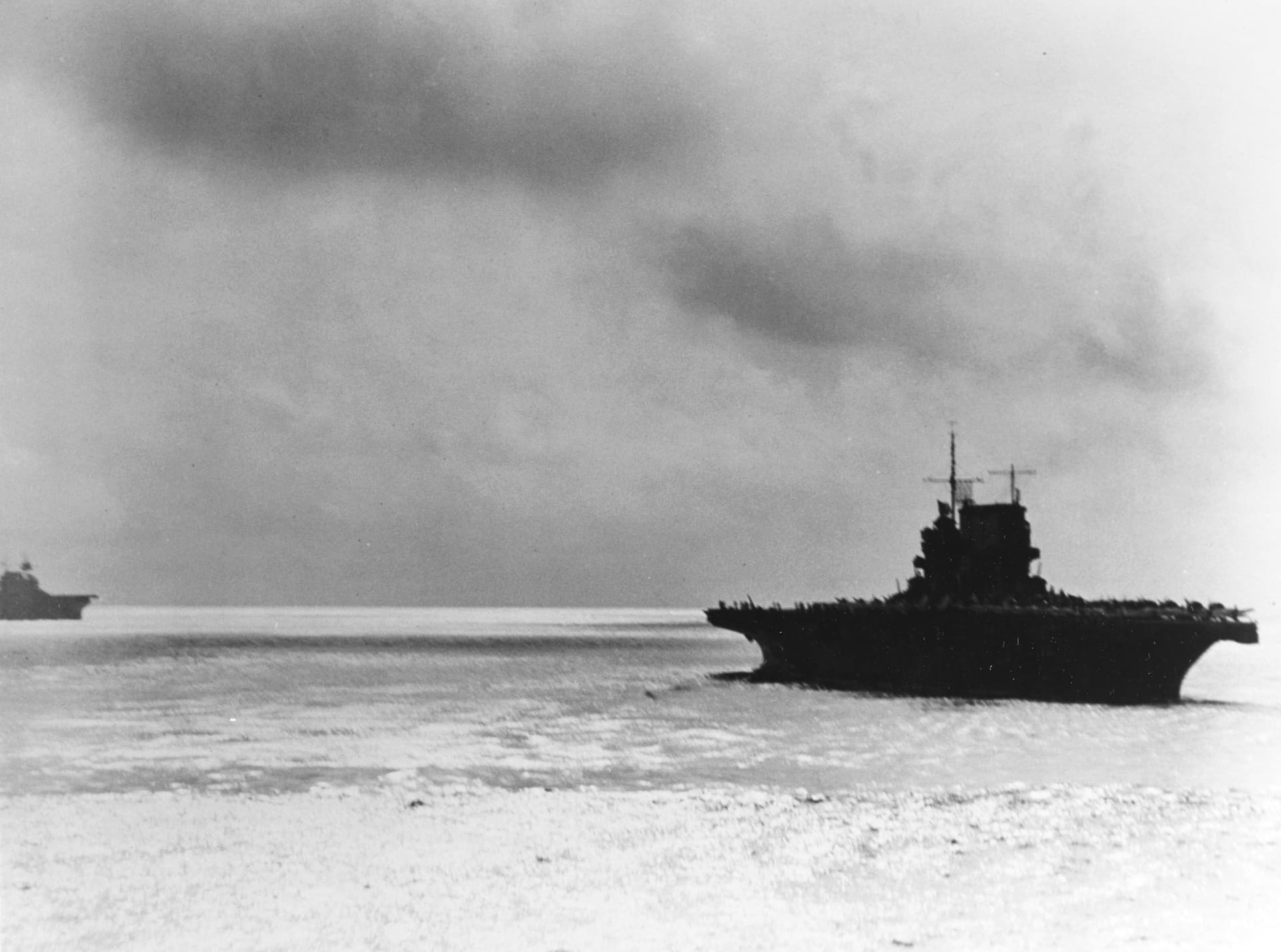 USS Saratoga (CV-3) operating near a rain squall in the Solomons Islands area on 11 August 1942