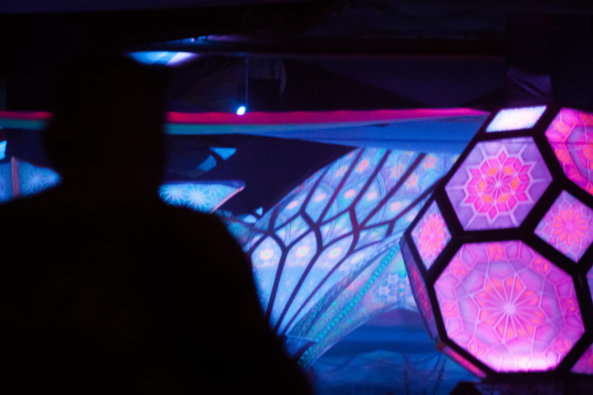 Illuminated hexagonal panels at a stage