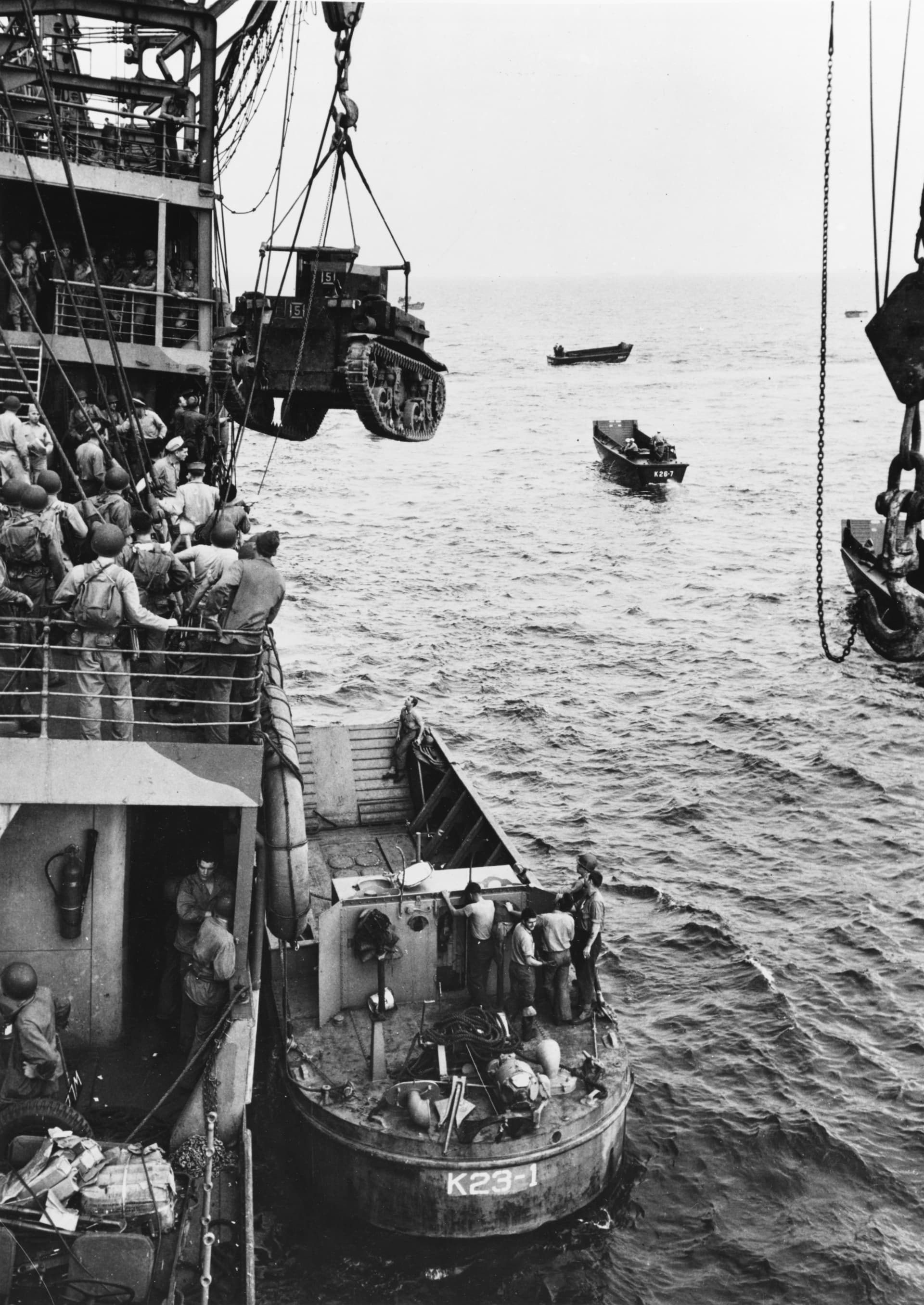 M2A4 Stuart tank is hoisted from USS Alchiba (AK-23) into a landing craft off the Guadalcanal, 7 August 1942 ( )