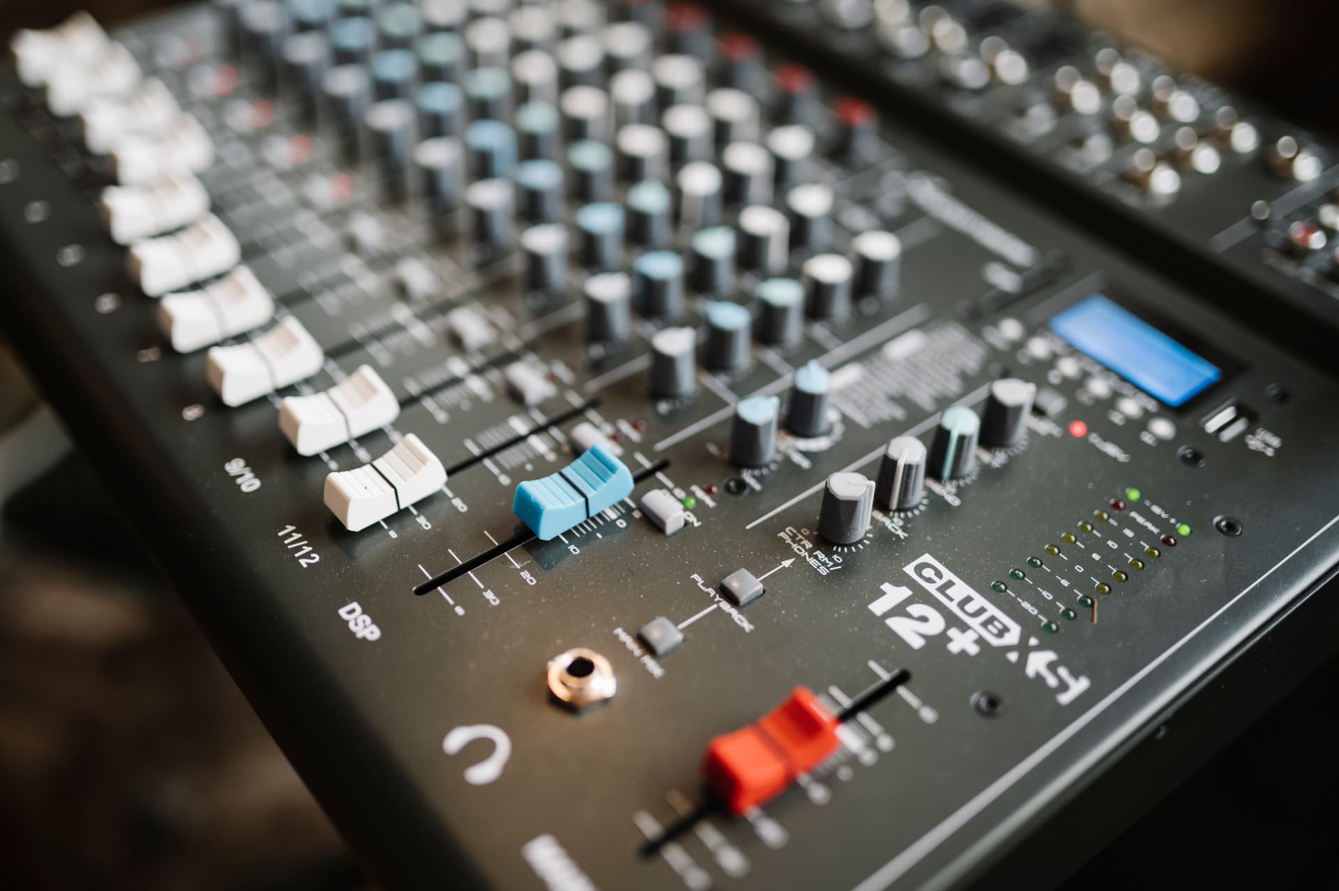 Mixing console setup in a modern studio showcasing professional sound equipment and controls undefined