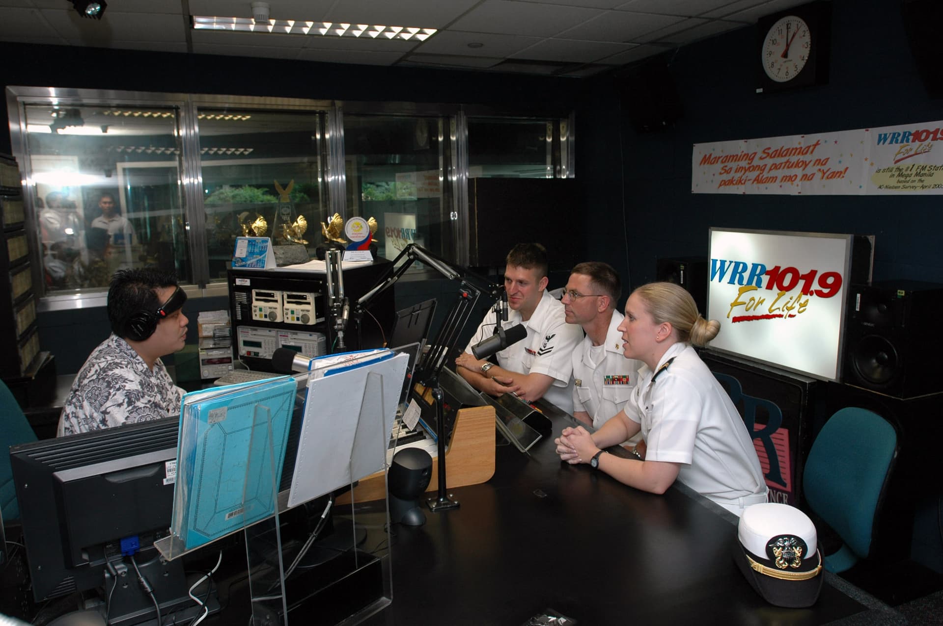 US Navy 060521-N-9076B-066 Lt. Janel Rossetto, Chief Musician Donald Chilton and Musician 2nd Class Ian Charlton appear as guests on one of