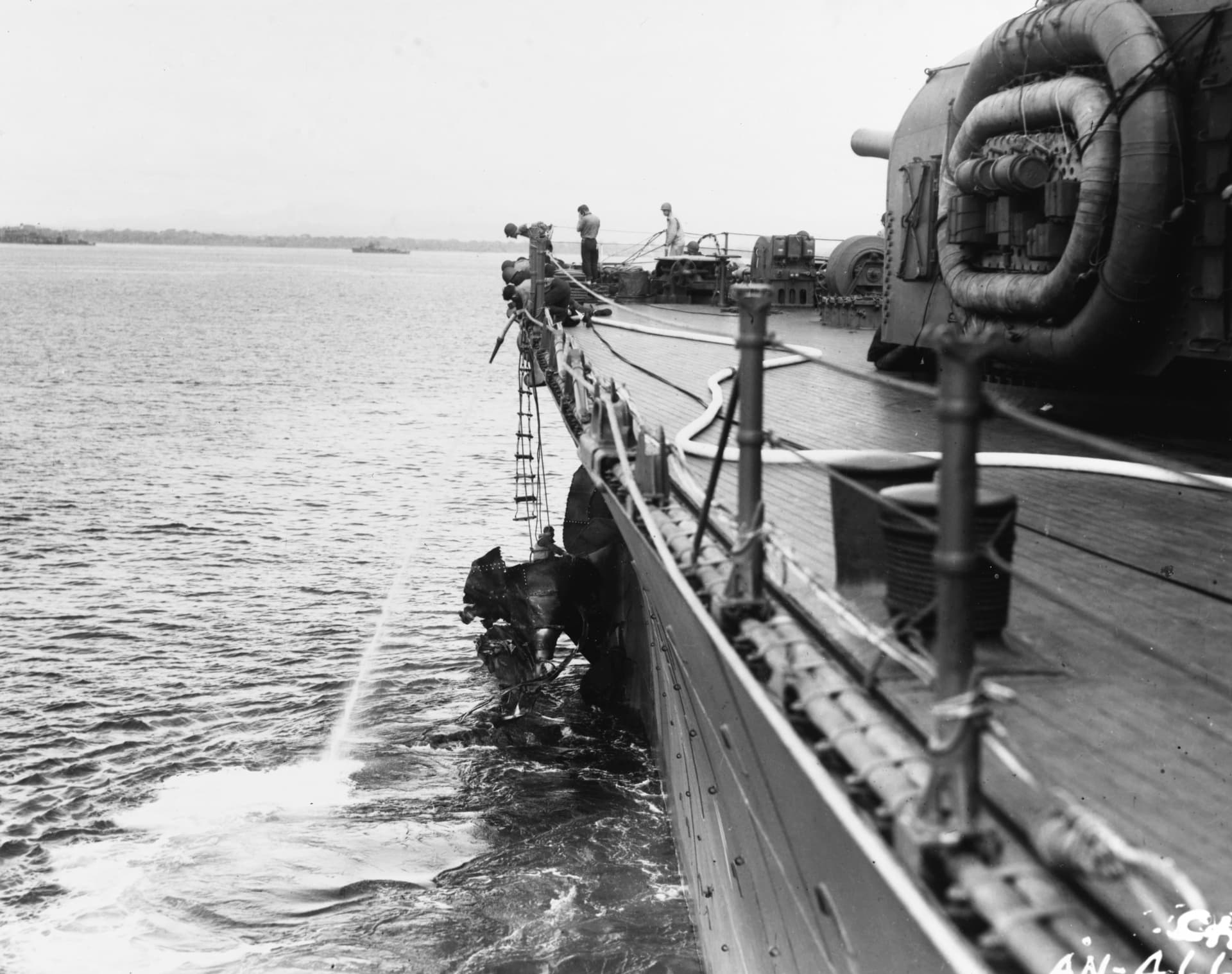 Crewmen working on the damaged bow of USS Chicago (CA-29) after the Battle of Savo Island on 9 August 1942